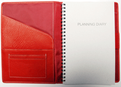 red classic leather planner with planning diary